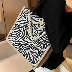 Zebra print canvas tote bag with pearl chain and vintage jute trim details