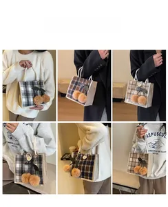 Linen plaid tote bag with cherry plush charm shown on model in various lifestyle poses