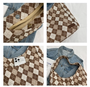 Detail view of checkered canvas tote bag showing magnetic buckle and inner pocket storage