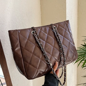 Brown quilted tote bag with silver chain straps and elegant faux leather texture