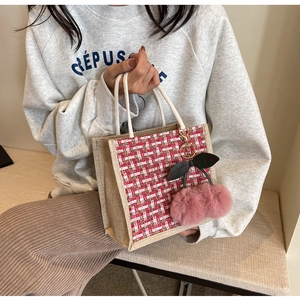 Linen woven lunch bag with tweed fabric detail and cherry charm accessory