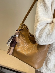 Vintage brown leather tote bag with butterfly embroidery and cute rabbit plush charm