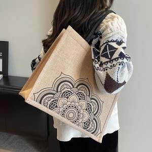 Linen tote bag with black mandala floral print and durable shoulder straps