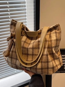 Large plaid wool tote bag with brown shoulder straps and a cute bear charm accessory