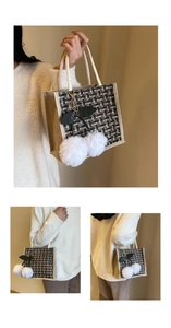 Detail of checkered tote bag with plush cherry charm and woven rope handles