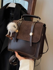 Retro dark coffee brown patchwork handbag with adjustable strap and plush pendant