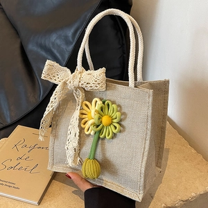Handheld burlap bento bag with white lace bow and floral embroidery decoration