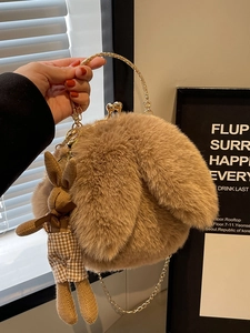 Cute fuzzy plush handbag in light brown with rabbit ears and golden ring handle