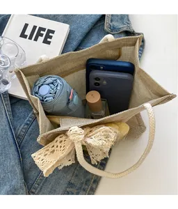 Linen tote bag interior showing large capacity for umbrella, phone, and perfume