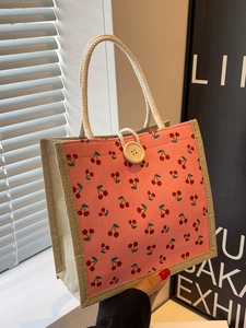 Pink cherry print corduroy handbag with linen trim and white woven rope handles