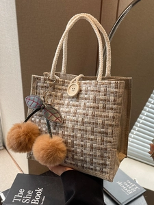 Plaid linen bento tote bag with white rope handles and brown cherry charm accessory