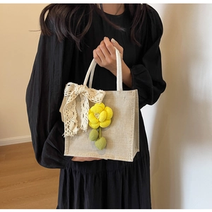 Linen handbag featuring handmade yellow 3D flowers and delicate lace bow detail
