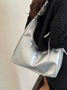Chic silver metallic crescent underarm bag with scrunchie strap for modern commuters