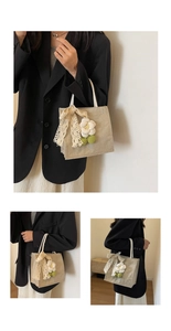 Detail of linen tote bag with lace bow, floral charm and durable woven texture
