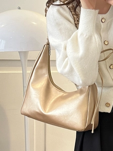 Champagne gold metallic hobo bag with pleated texture and stylish crescent shape for women