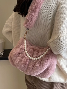 Pink fuzzy cloud crossbody bag with faux pearl strap and plush shoulder handle