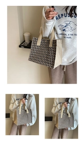Detail of retro woven tote bag with tricolor pattern and beige canvas handle accents