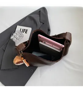 Detail view of large capacity dark brown PU leather hobo bag showing spacious interior space
