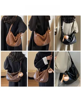 Detailed views of leather hobo bags in brown and black with plush charm accessories