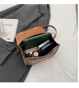 Interior view of vintage brown backpack showing large capacity for tablet and essentials