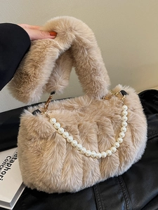 Beige faux fur crossbody bag with quilted stripes and elegant pearl chain strap