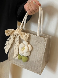 Linen tote bag with large white camellia flower and lace bow, rustic woven handbag style