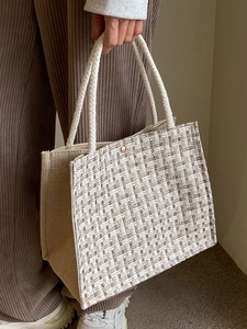 Large woven tote bag with brown plaid pattern and rope handles for commute and vacation