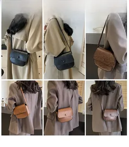 Three elegant vintage-style crossbody bags in black, dark brown, and khaki on a model