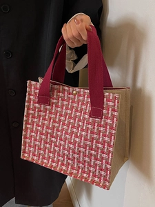 Red tweed tote bag with classic weave pattern and beige side panels for daily commute