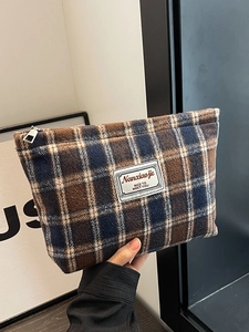 Classic checkered makeup bag in tweed fabric with silver zipper and woven label