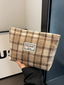 Large plaid cosmetic travel bag in khaki fabric with metal zipper and logo tag
