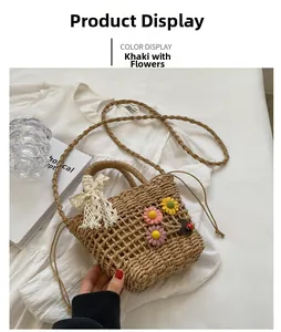 Close-up of khaki handmade straw beach bag with 3D flowers and lace ribbon detail