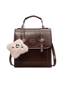Dark brown retro PU shoulder bag with white stitching and cute plush charm detail