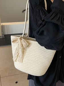 Handwoven large capacity straw tote bag with elegant lace bow detail for beach vacations