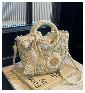 Detail view of handmade woven bag with lace bow, sunflower applique and drawstring closure
