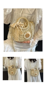 Detail of beige hand-woven straw bag with daisy flower, lace bow, and drawstring liner