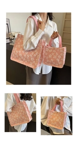 Detail of pink canvas tote bags with white floral embroidery and sturdy straps