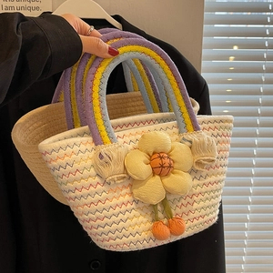 Handwoven summer beach tote bag with colorful stitching and 3D floral accent detail