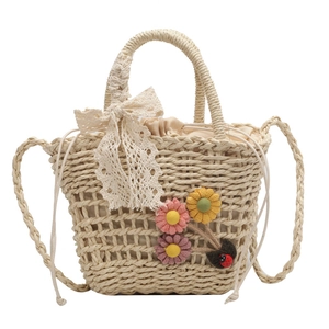 Handmade straw beach bag with floral lace bow and versatile woven shoulder straps