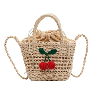 Handwoven straw beach bag with crochet cherry charms and drawstring inner pocket
