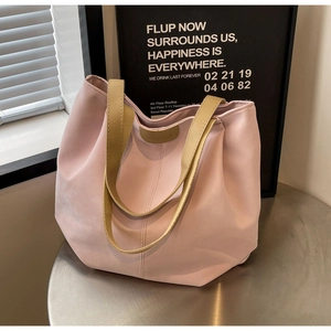 Detailed shot of pink tote bag with fashion tag and smooth waterproof nylon texture