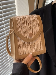 Handmade woven crossbody bag for women with leather trim and gold hardware detail
