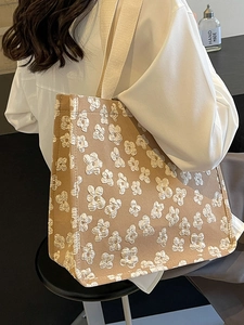Large khaki canvas tote bag with 3D floral embroidery and wide straps for daily commuting