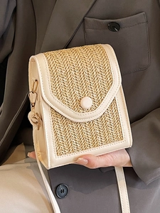 Handwoven straw crossbody bag with cream leather trim and gold metal hardware for women