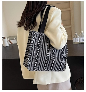 Detail showing the geometric woven pattern and durable strap of the large ethnic tote bag