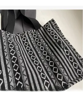 Close-up of black and white geometric ethnic pattern on large canvas tote bag
