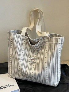 Large capacity corduroy tote bag in cream white with dark stripes and woven handles
