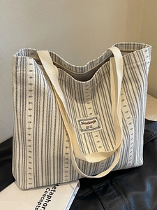 Large capacity corduroy tote bag with black stripes and textile handles for daily commuting