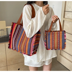 Close-up of a two-piece ethnic striped tote bag set with colorful woven patterns