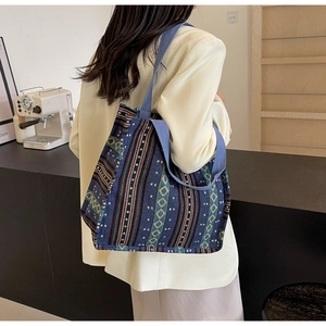 Detailed view of large ethnic canvas tote bag with colorful geometric woven patterns